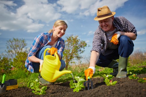 Site briefing and safety equipment at a garden service